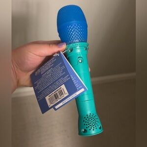 Blue and Green Toy Microphone
